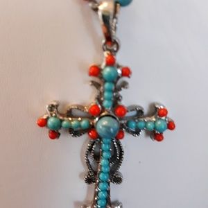 Coral and blue colored cross necklace